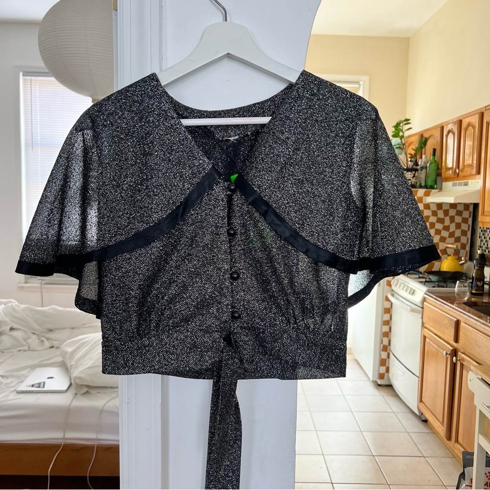 Vintage 1980s glittery shimmery crop top with tie waist and faux cape wings.